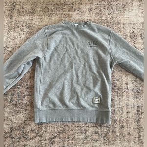 nike grey crew neck light stain not noticable